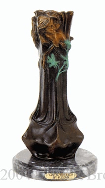Faces bronze vase by T. Loran