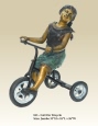 Girl on Tricycle bronze sculpture