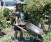 Girl With Wheelbarrow bronze statue