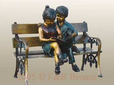 Boy and girl bronze statue