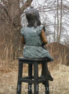 Girl with Teddy Bear on stool bronze