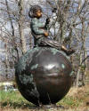 Girl Sitting on Globe Reading Bronze