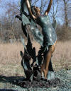 Lady with Dolphin Jumping Overhead bronze sculpture