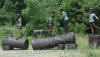 4 Kids on Logs with a dog bronze reproduction