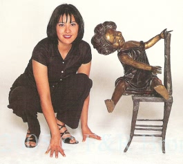 Large Girl On Chair Bronze by J. Clara