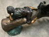 Three kids on log with squirrel bronze