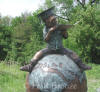 Boy Reading on Globe bronze sculpture