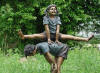 Playing Leapfrog bronze sculpture