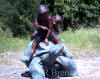 Two kids riding turtle bronze sculpture