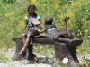 Two Girls on Bench Reading Bronze statue