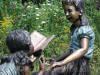 Girls on Bench Reading Bronze statue