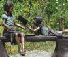 Kids on Bench Reading Bronze statue