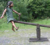 Kids on Seesaw bronze statue