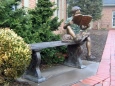 Boy Reading on Bench with Dog bronze